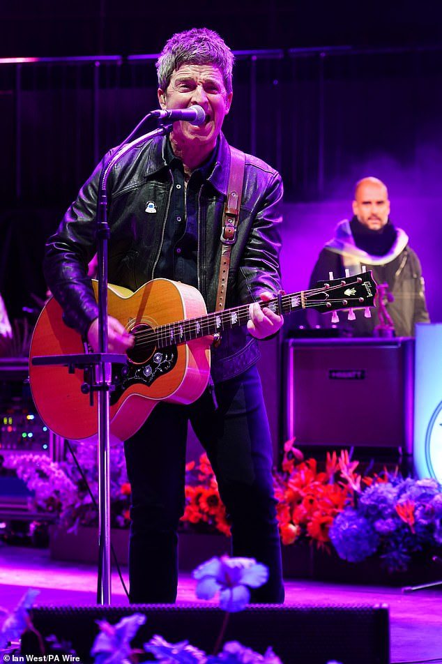 Why has Pep Guardiola appeared on stage with Noel Gallagher? The Man City boss was spotted behind the rockstar at a Royal Albert Hall charity gig last night, but the former Oasis songwriter can explain!